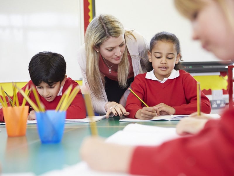 teacher helping student with math