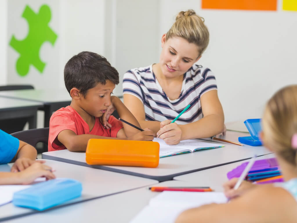 teacher helping student with math