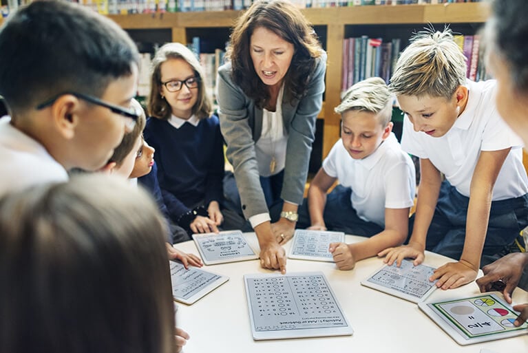 teacher engaging students with technology